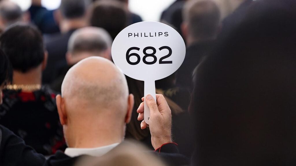 A bidder at a Phillips auction image