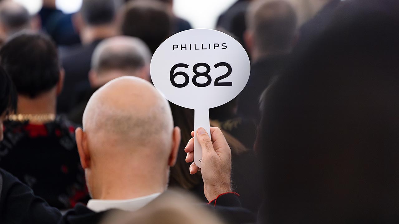 A bidder at a Phillips auction image