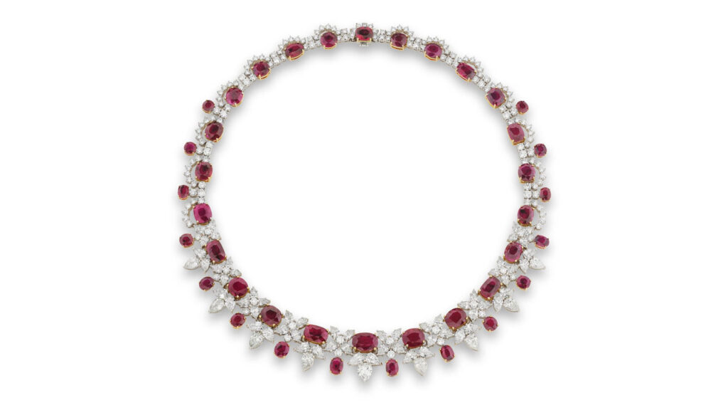 A necklace comprising oval, cushion-shaped and circular-cut rubies between pear-shaped and brilliant-cut diamonds at Phillips image