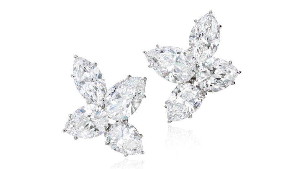 A pair of Harry Winston earrings, each featuring one marquise and three pear-shaped diamonds, with a total weight of around 16.15 carats at Phillips image
