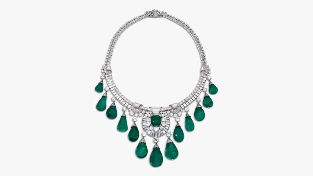 This necklace features a graduated fringe of 13 drop-shaped Colombian emeralds weighing between 11.38 and 57.82 carats, centering an 11.76-carat cabochon Colombian emerald at Sotheby's image
