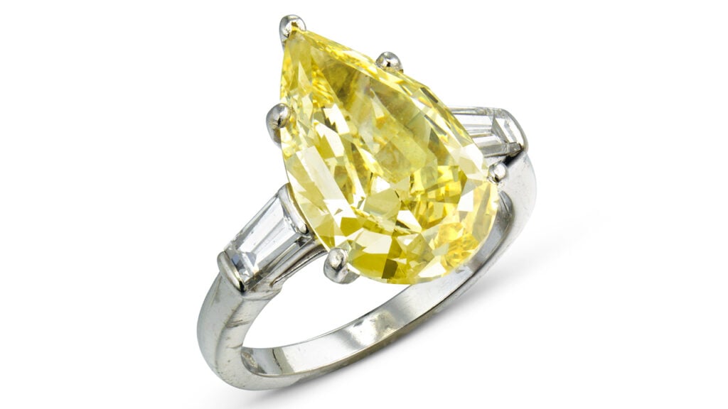 A Bulgari ring bearing a pear mixed-cut, 5.26-carat, fancy-intense-yellow, VS2 diamond between tapered baguette-cut stones at Christie's image
