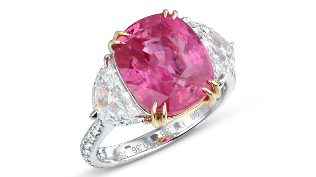 Christie’s is offering a ring with a cushion-shaped, 6.99-carat Madagascar padparadscha sapphire between two half-moon diamonds, with round diamonds on the band at Christie's image