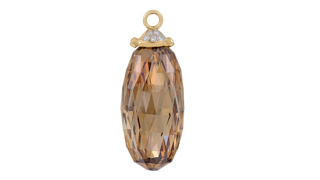 A briolette-cut, 66.40-carat, fancy-orange-brown, I1, type IIa diamond pendant suspended from five circular-cut diamonds at Christie's image