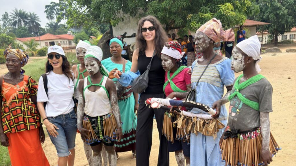 Tracey Ellison with locals in Sierra Leone image