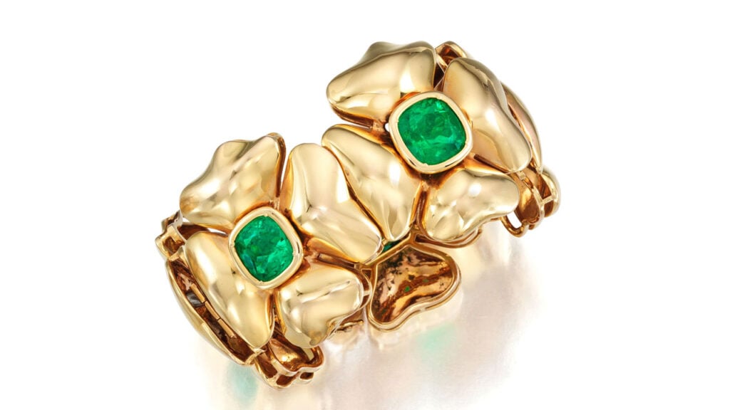 A bracelet featuring five cushion-cut Colombian emeralds weighing a total of 35 carats, each within a quatrefoil flower motif at Bonhams image