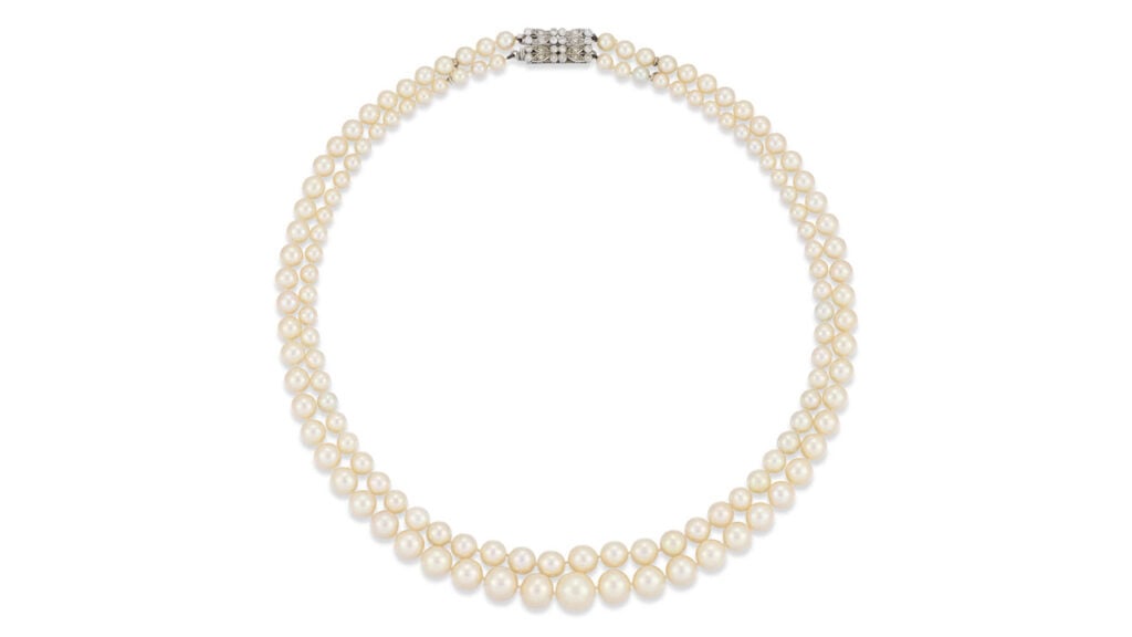 A necklace with 130 natural saltwater pearls in two graduating rows. Its claps bears single-cut diamonds at Christie's   image
