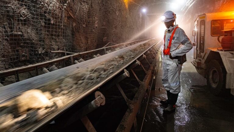 A worker performing an inspection at the Finsch mine at Petra Diamonds image