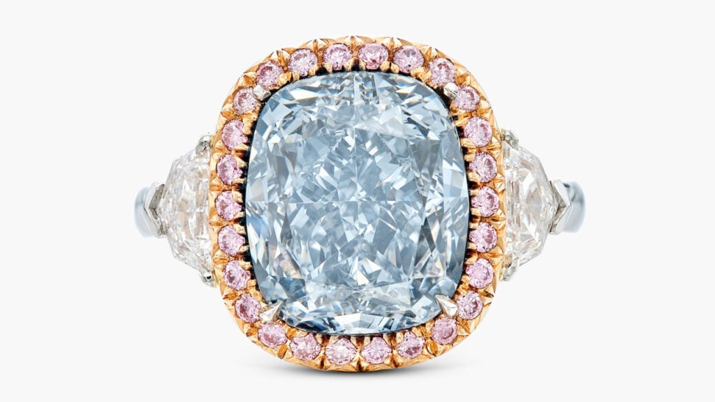 This ring centers a cushion modified brilliant-cut, 6.76-carat, fancy-greyish-blue, SI1 diamond, framed by round, pink-hued diamonds, between a pair of shield-shaped stones at Sotheby's image