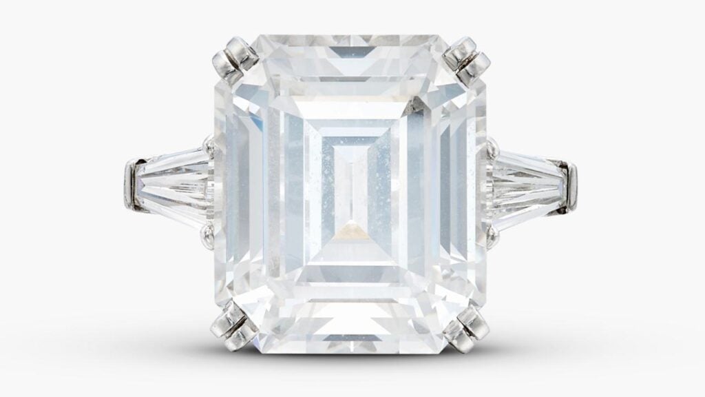 This ring features an emerald-cut, 15.11-carat, D, VVS2 diamond between a pair of tapered baguette diamonds at Sotheby's image