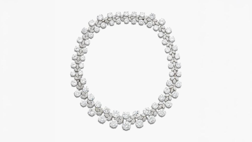 A Harry Winston necklace, which can also be worn as two bracelets. It features graduated pairs of round diamonds, alternating with marquise-shaped diamond clusters at Sotheby's image