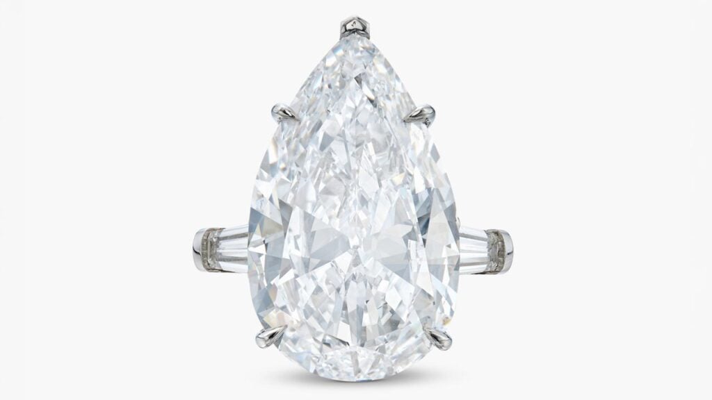 A Harry Winston diamond ring, offered without reserve, has a pear-shaped, 15.05-carat, D-color, internally flawless center stone, flanked by a pair of tapered baguette diamonds at Sotheby's image