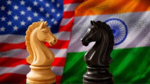 Chess pieces with the US and Indian flags in the background image