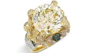 The multi-gem ring featuring a 14.26-carat yellow diamond at Christie's image