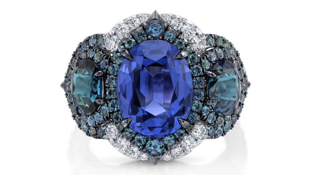 An Omi Privé ring featuring a color-change spinel between alexandrite and garnet side stones image