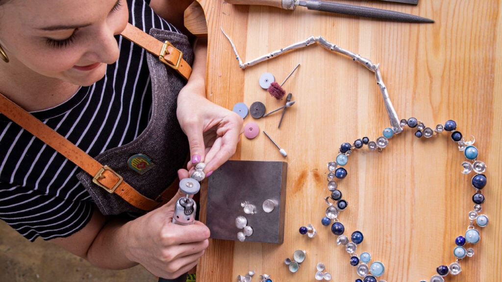 A SCAD student works on jewelry image