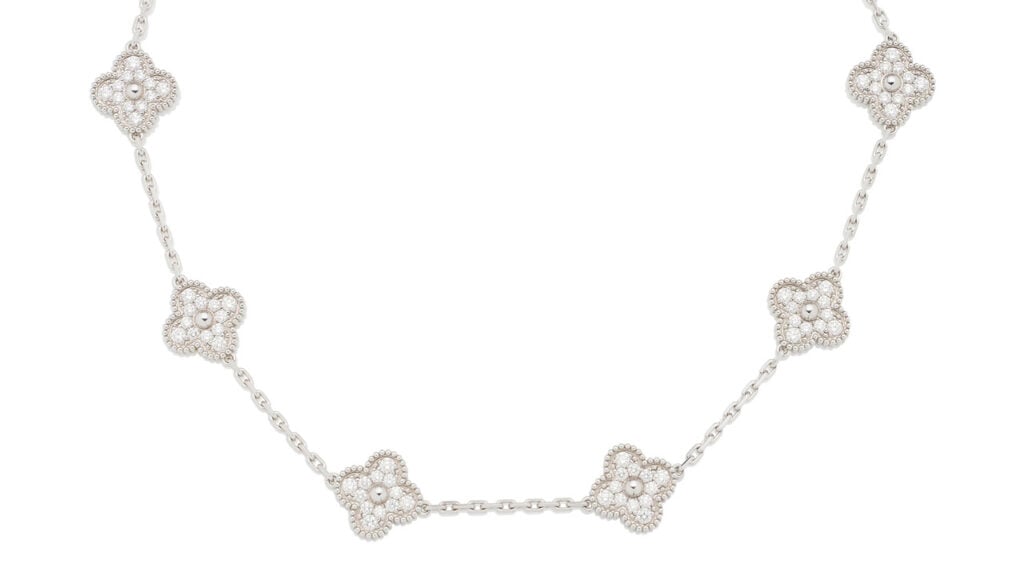 A Van Cleef & Arpels Alhambra necklace comprises 10 quatrefoil motifs with brilliant-cut diamonds, each separated by a linked chain. The diamonds weigh approximately 4 carats in total at Bonhams image