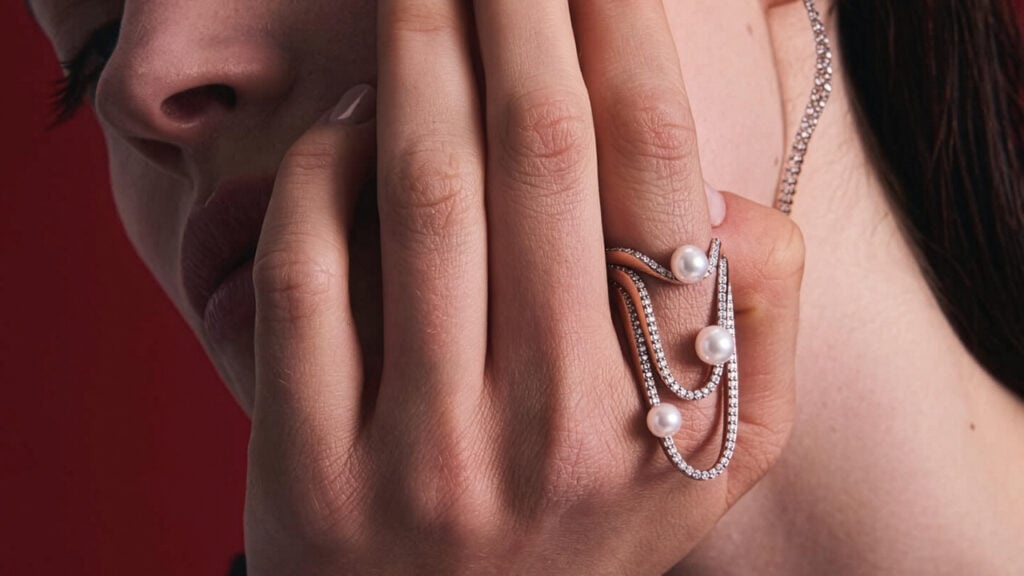 Paloma’s ring stack and other pearl and diamond jewels by Marie Mas on model image
