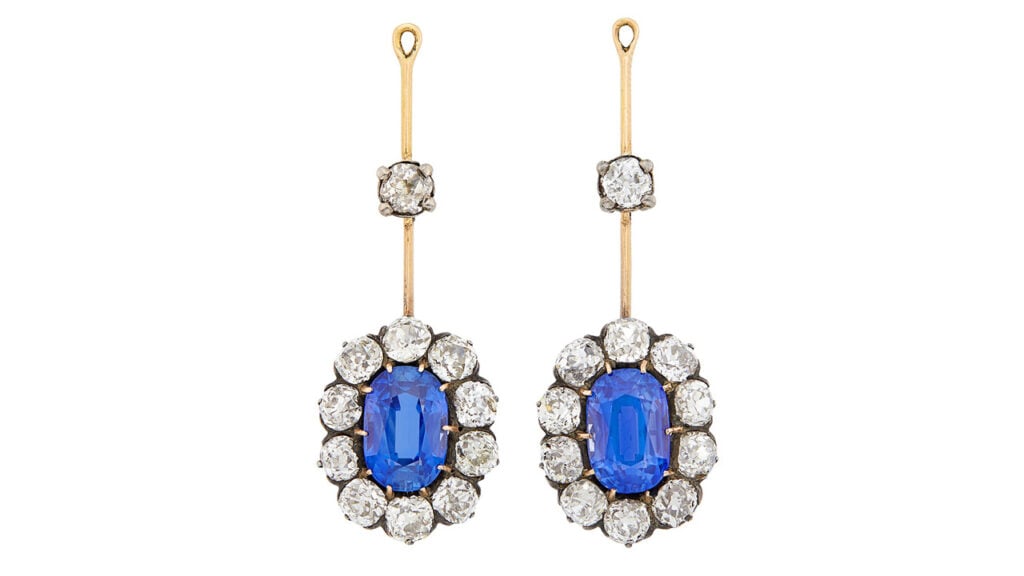 A pair of antique earrings from 1890, one sporting an oval, 4-carat Ceylon sapphire and the other an oval, 4.17- carat Kashmir sapphire, each in a surround of 10 old-mine diamonds at Doyle image