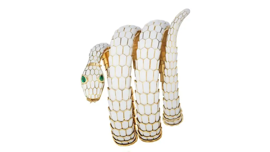 A Bulgari Serpenti emerald and enamel belt, which can also be worn as a necklace, has a white enamel head and body, with pear-shaped emerald eyes at Phillips image