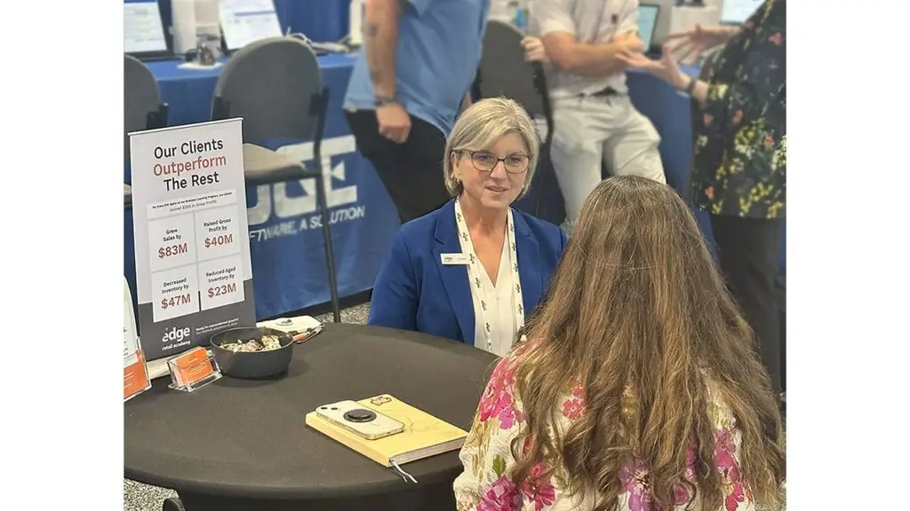 Charleen Pfaff meeting with a client at a trade show image