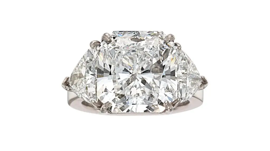 A ring bearing a square, 10.89-carat, D-color, VS2 diamond between two triangular-diamond shoulders at Heritage Auctions image
