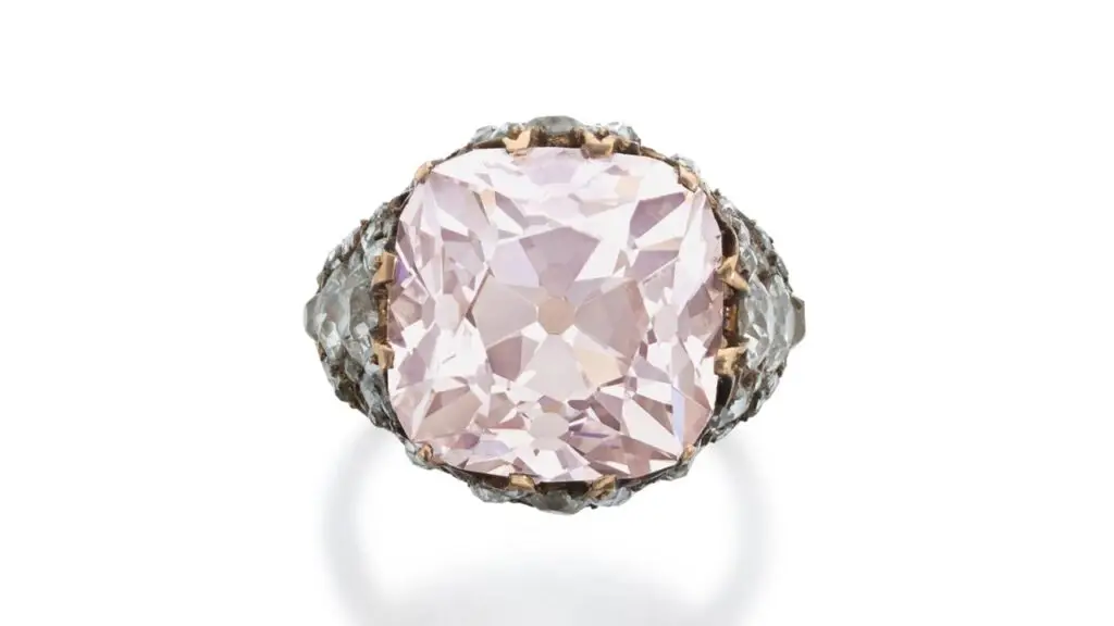 A ring owned by Empress Catherine I of Russia, which Ottoman Princess Neslishah Sultan later received for her wedding, contains a brilliant-cut, 13.86-carat, light-pink, VS2-clarity diamond and old mine- and rose-cut embellishments at Sotheby's image