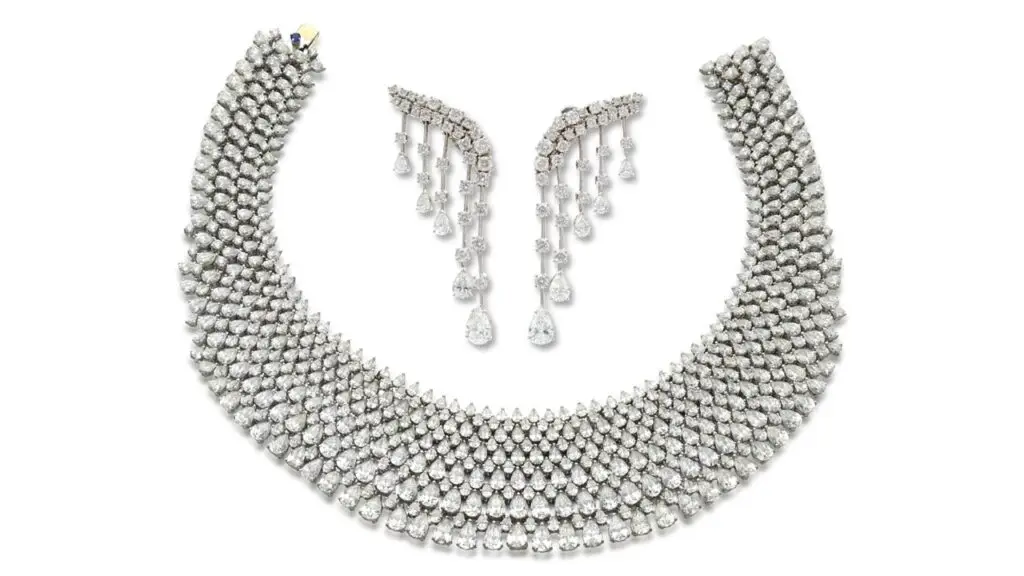 This three-piece diamond demi-parure by Schreiner comprises a choker with pear-shaped diamonds throughout, enhanced with brilliant-cut stones — 140.62 carats in total — along with a pair of fringe-style pendant earrings by Sotheby's image