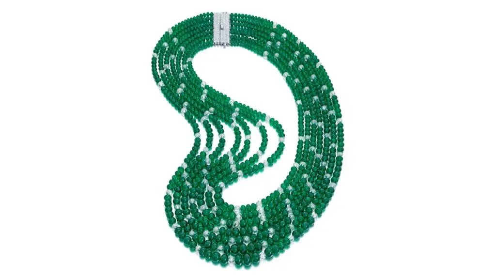 A piece from Schreiner, an emerald and diamond necklace, features seven slightly graduated rows of emerald beads weighing 509.98 carats, interspersed with 101.70 carats of faceted diamond beads at Sotheby's image
