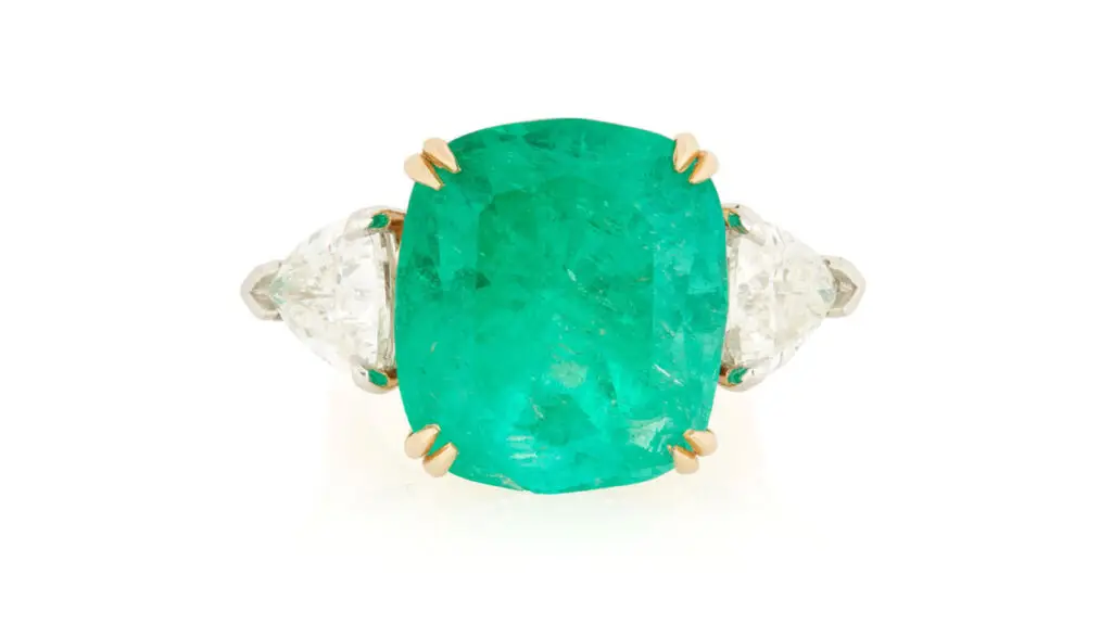 Ring bearing a cushion modified brilliant-cut, 17.02-carat Colombian emerald between triangular-cut diamonds at John Moran image