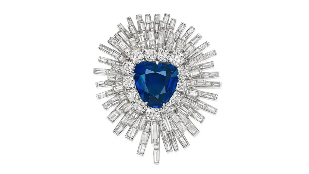 This brooch centers a pear-shaped, 20.82-carat Burmese sapphire with an old European- and old mine-cut diamond surround, in a detachable sunburst-style frame accented with baguette-cut diamonds at Bonhams image