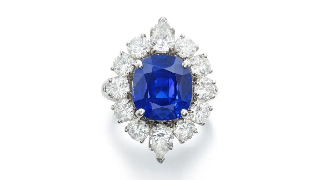 This Van Cleef & Arpels ring features a cushion-shaped, 7.69-carat Kashmir sapphire in a pear-shaped and brilliant-cut diamond frame at Sotheby's image