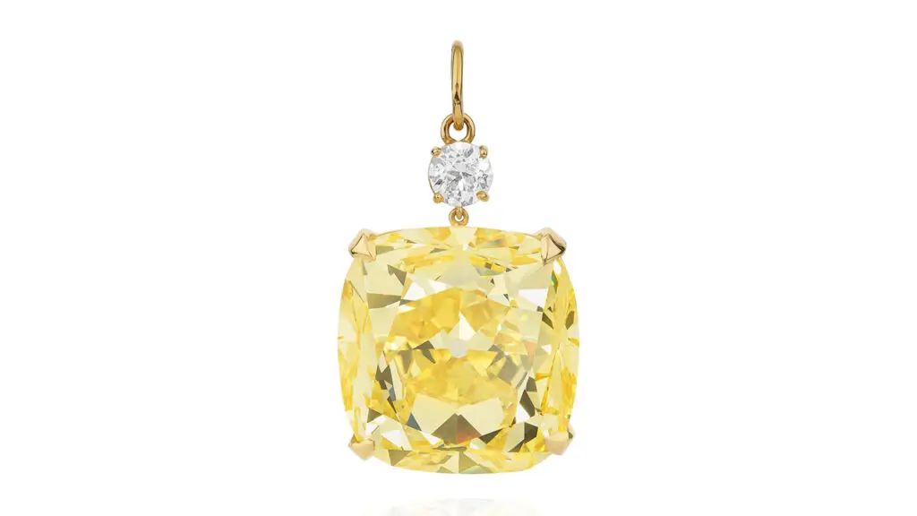 53.14-carat, fancy-vivid-yellow, internally flawless diamond pendant, suspended from a round brilliant diamond at Phillips image