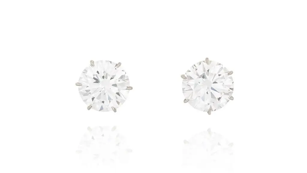 A pair of stud earrings with brilliant-cut, D-color, VVS1-clarity diamonds weighing 8 and 8.82 carats at Phillips image