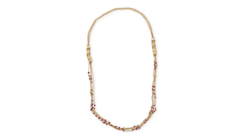 This Boucheron Frou Frou necklace features two textured gold-stack motifs, set with round diamonds and suspending four gold chains decorated with round faceted pink tourmaline beads and round diamonds at John Moran image