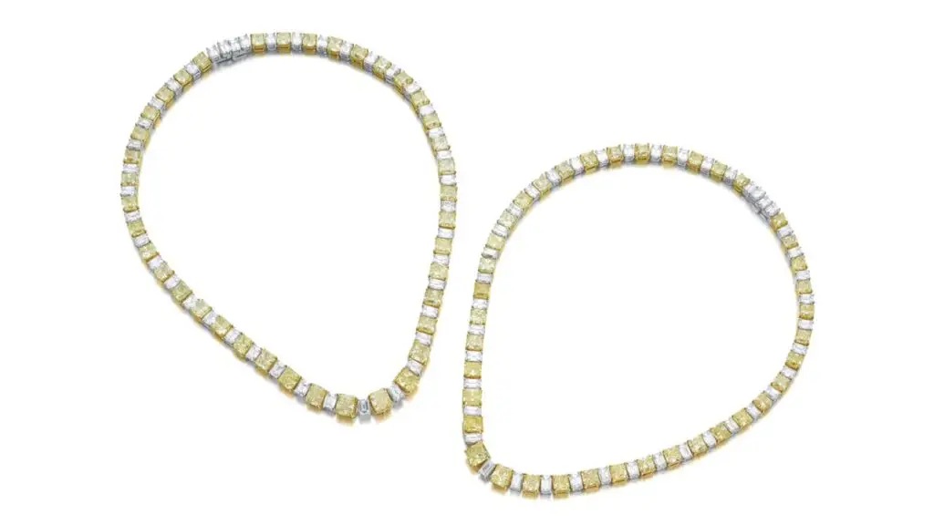 A pair of Schreiner necklaces, each designed as a graduated row of diamonds. These include cut-cornered, round-cornered square and rectangular modified brilliant-cut, fancy-yellow diamonds and diamonds with a yellow tint, alternating with step-cut diamonds. The largest is a 1.02-carat, fancy-yellow, SI1 stone at Sotheby's image
