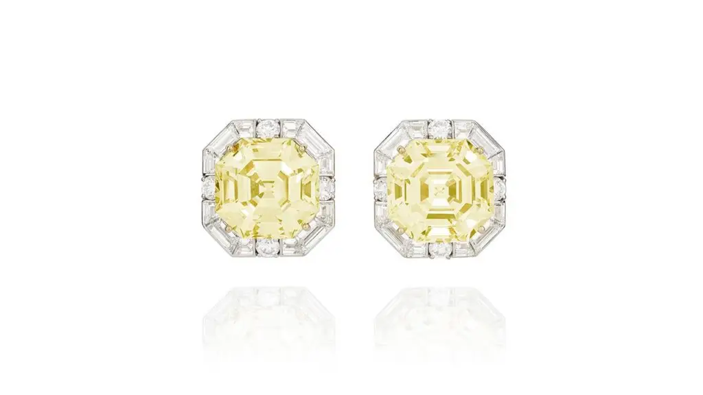These Graff earrings with octagonal step-cut, fancy-yellow diamonds weighing 20.33 and 21.38 carats in baguette and brilliant-cut diamond surrounds at Phillips image