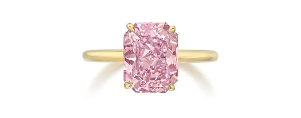 A ring featuring a radiant-cut, 3.03-carat, fancy-intense-pink diamond at Phillips image