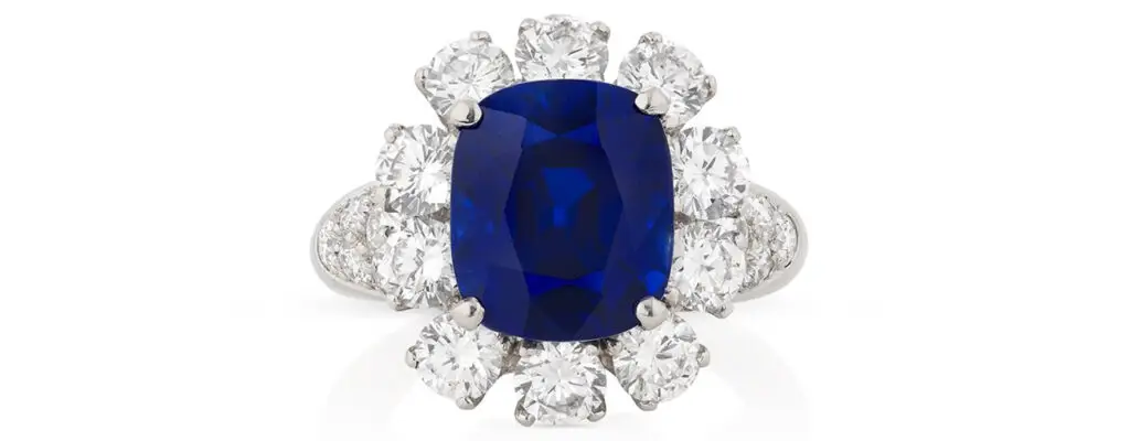A ring from Van Cleef & Arpels centering a 7.11-carat Kashmir sapphire framed by diamonds at Phillips image