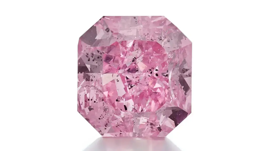 A unmounted cut-cornered rectangular modified brilliant-cut, 3.63-carat, fancy-vivid-purple-pink, I2-clarity diamond at Sotheby's image