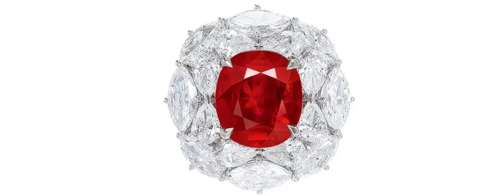This ring with a cushion-shaped, 5.21-carat Burmese ruby in a marquise, pear and circular-cut diamond surround at Poly Auction image
