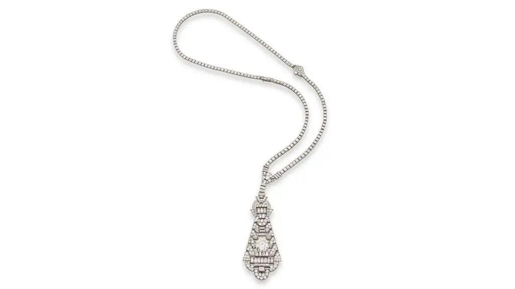 Van Cleef & Arpels designed this pendant in the 1920s. It sports a step-cut, 10.79-carat diamond and circular-cut and baguette diamonds at Phillips image