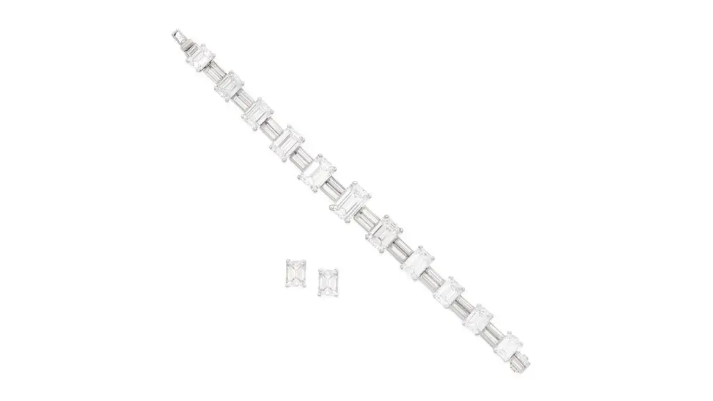 A set comprising an Aldao bracelet and a pair of ear studs. The bracelets has step-cut diamonds graduating in size toward the center, alternating between links with duos of baguette-cut diamonds. Each of the ear studs contains a step-cut diamond at Bonhams image