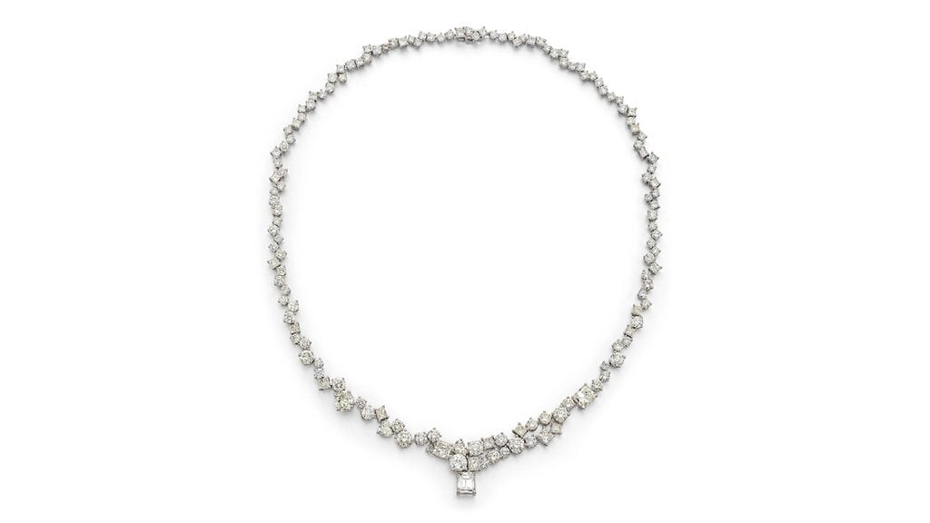 A necklace sporting a detachable emerald-cut, 1.66-carat, F, VS1 diamond, with the remaining diamonds weighing 28.20 carats at Bonhams image