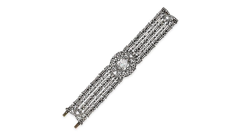 A diamond bracelet centering an old European-cut diamond in a diamond surround. The main stone stone is estimated at 4.65 carats, with G to H color and I clarity at Bonhams image