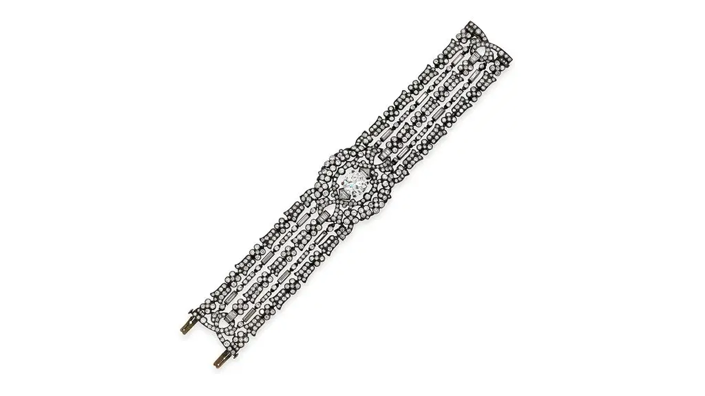 A diamond bracelet centering an old European-cut diamond in a diamond surround. The main stone stone is estimated at 4.65 carats, with G to H color and I clarity at Bonhams image