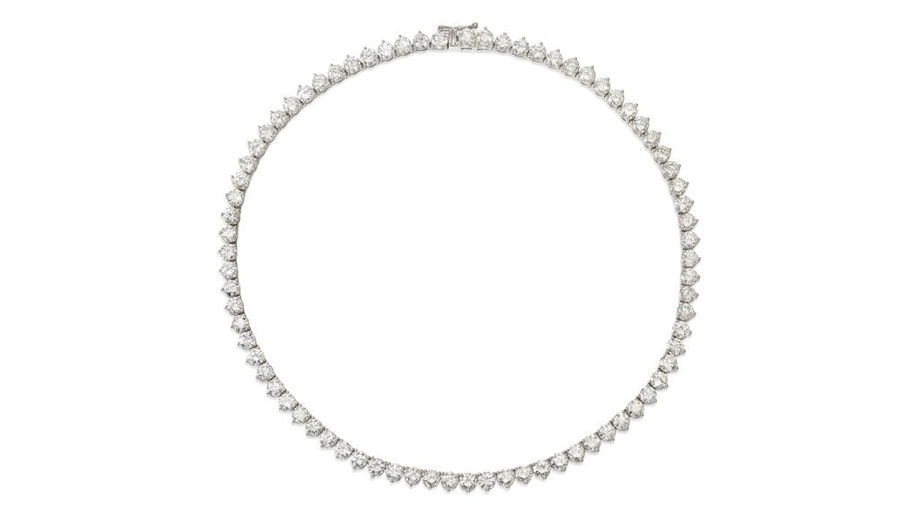 This necklace sports a line of approximately 75 round brilliant-cut diamonds weighing 37.70 carats in total, in I to K color and mostly VS clarity at Bonhams image