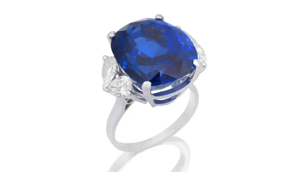 A ring featuring a cushion-cut, 25.48-carat Sri Lankan sapphire between pear-cut diamonds at Bonhams image