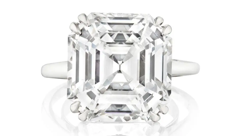 A ring bearing an emerald-cut, 11.20-carat, E-color, VS1 diamond at Bonhams image