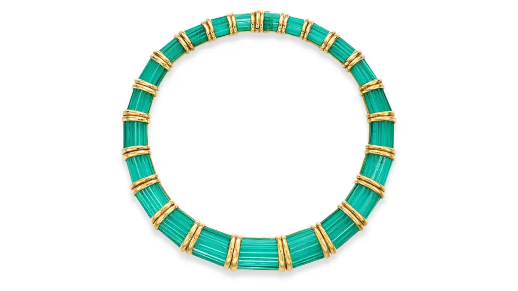 A Fabre choker set throughout with elongated calibré-cut emeralds that graduate in size toward the front, between gold collets at Bonhams image